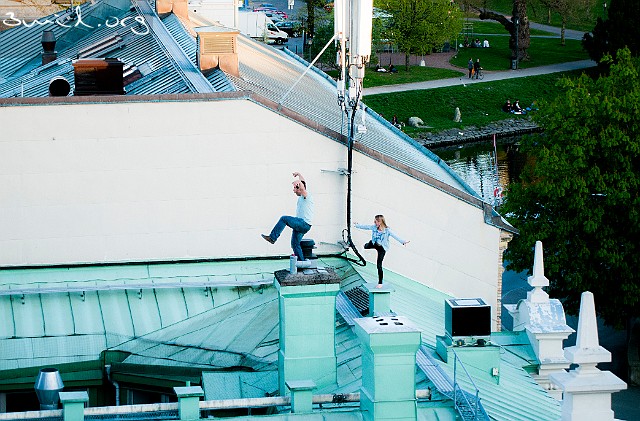 Sweden, Gothenburg Drunk guys on a roof, Kungsportsplatsen, Gothenburg, Sweden